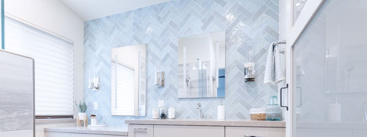Master Bathroom vanity backsplash installed in a herringbone pattern.