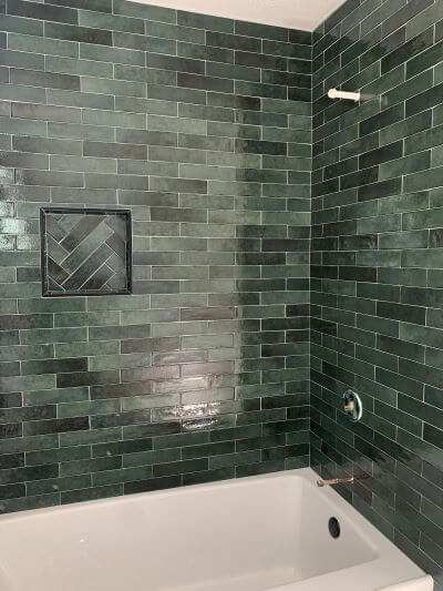 Emerald green tub surround tile.