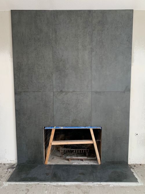 Fireplace wall xl large format tiles.