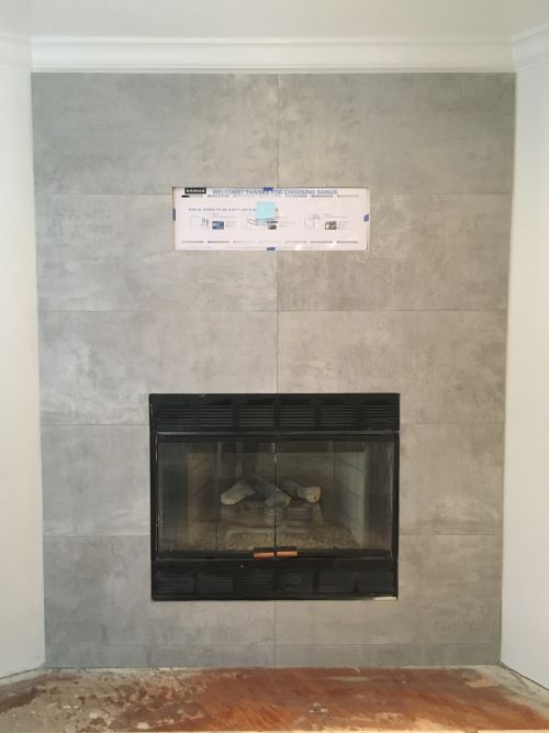 Large format tiled fireplace wall.