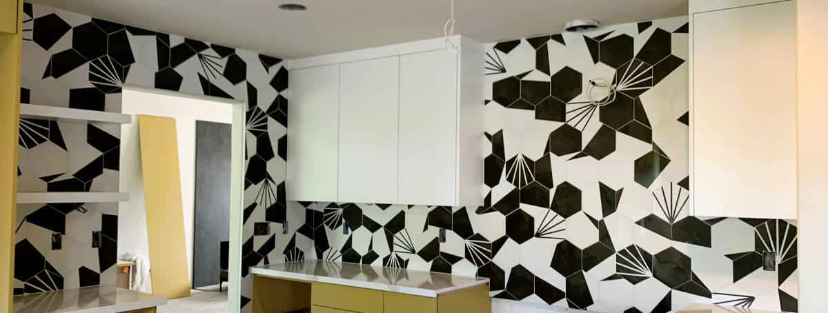 Black and white hexagon tiled kitchen backsplash.