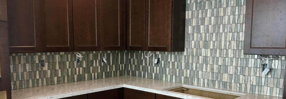 Kitchen backsplash trapezoid mosaic tile.